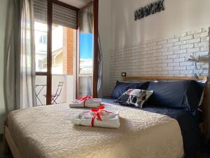 a bedroom with a bed with two towels on it at Sweet Rome B&B in Rome