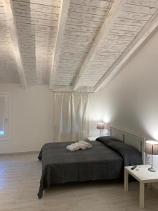 En eller flere senge i et værelse på San Paolo Rooms