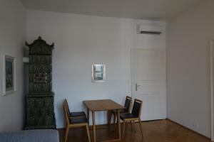 a dining room with a table and chairs at Hager Apartment in Merano