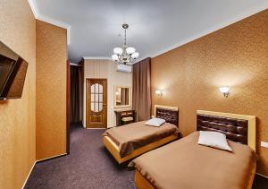 Łóżko lub łóżka w pokoju w obiekcie Venecia Hotel & SPA
