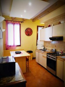 a kitchen with a sink and a stove top oven at Booking San Marco Apartment in Venice