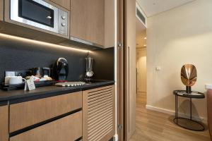 Kuchyň nebo kuchyňský kout v ubytování Suites Murillo Plaza Sta. Cruz