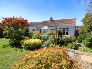 a house with a garden in front of it at Harlyn in Mevagissey