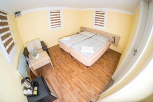 Postel nebo postele na pokoji v ubytování Obora resort