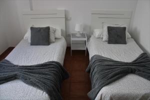 Posteľ alebo postele v izbe v ubytovaní Apartamento los Rostros