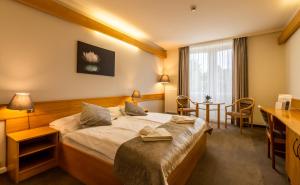 Posteľ alebo postele v izbe v ubytovaní Aqua Hotel Termál