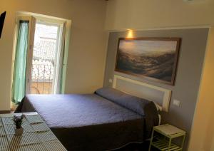 Postel nebo postele na pokoji v ubytování Alter Ego b&b Assisi