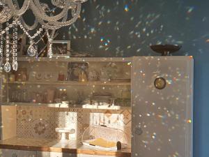 a toy kitchen with a shelf with dishes on it at Villa Elisa in Gambettola