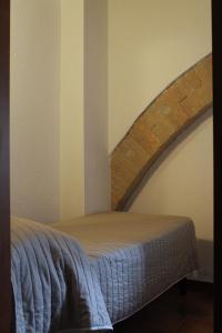 Postel nebo postele na pokoji v ubytování Alter Ego b&b Assisi