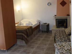 Ένα ή περισσότερα κρεβάτια σε δωμάτιο στο Drosostalida