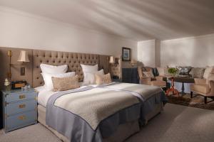 a bedroom with a large bed and a desk at The Gleneagles Hotel in Auchterarder +37 photos