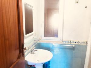 a bathroom with a sink and a window at Ponza Cala Feola IMMOBILEVANTE in Ponza +54 photos