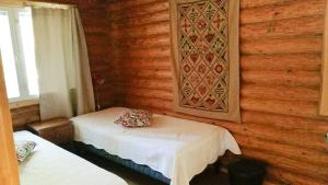 Postel nebo postele na pokoji v ubytování Kaijonselän mökit Pyhitty