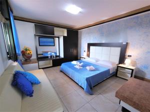 Postel nebo postele na pokoji v ubytování Hotel Alba Chiara Sant'Andrea Salento