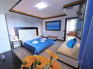 Postel nebo postele na pokoji v ubytování Hotel Alba Chiara Sant'Andrea Salento