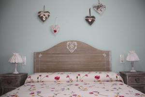 Una cama o camas en una habitación de Casa Mireia i Paula 26 fotos más