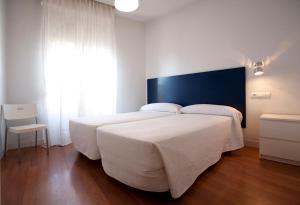 Postel nebo postele na pokoji v ubytování Hostal Santa Isabel