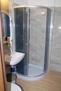 a bathroom with a shower and a sink at Willa Anna in Szczawno-Zdrój