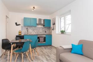 Kuchyň nebo kuchyňský kout v ubytování Apartment Aquamarine