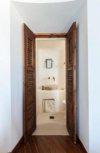 a bathroom with a toilet and a sink at Castle Panigirakis in Mikonos