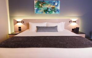 Ліжко або ліжка в номері QUARTZ HOTEL & SPA