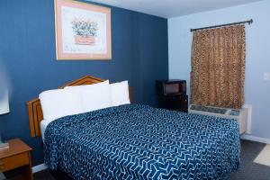 מיטה או מיטות בחדר ב-At 9 Motel