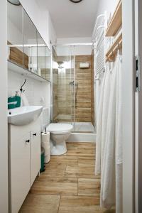 Een badkamer bij Komfortowo Plus
