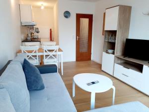 a living room with a couch and a table at Apartment Anja in Schluchsee