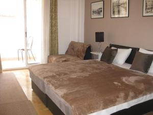Postel nebo postele na pokoji v ubytování Liberta Apartment