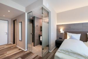 Postel nebo postele na pokoji v ubytování Hotel Knoblauch