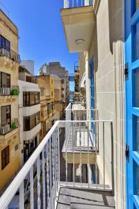 a balcony with a view of a city at The Exiles Hotel in Sliema