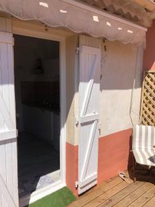an open door of a house with a porch at Studio terrasse Sanary centre ville rue piétonne in Sanary-sur-Mer