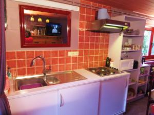 a kitchen with a sink and a counter top at Forgatz' Studio in Bruges