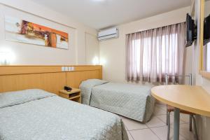 Voodi või voodid majutusasutuse Hotel Express São Leopoldo toas