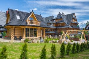 Vonkajšia záhrada v ubytovaní Domek & Apartament Góralski z Jacuzzi Kościelisko