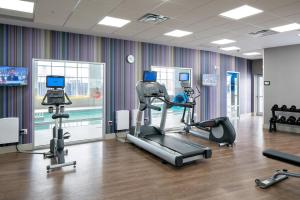 a gym with cardio equipment in a room at Holiday Inn Express - Red Deer North, an IHG Hotel in Red Deer