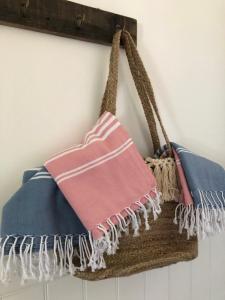 a pair of towels hanging on a wall at Katjas Kate Gartenwohnung in Prerow