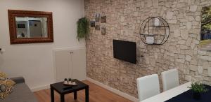 Televízia a/alebo spoločenská miestnosť v ubytovaní Apartamento EL CARMEN con Parking GRATIS