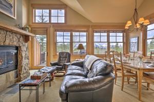 a living room with a couch and a fireplace at 3 Mi to Keystone Resort: Condo w/ Mountain View in Keystone