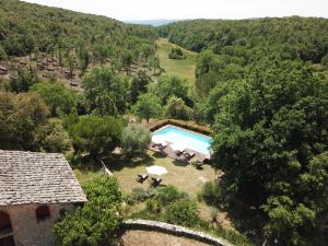 an aerial view of a villa with a swimming pool at Borgo dei Fondi in Siena