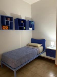 Posteľ alebo postele v izbe v ubytovaní a casa di barbara
