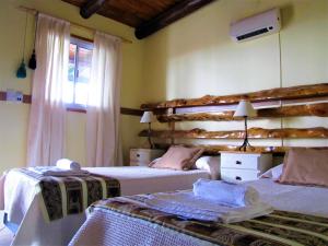 Una cama o camas en una habitación de Portal de La Cumbre