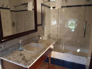 a bathroom with a sink and a shower at Turismo de Interior S'Ardeviu in Sóller