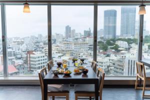 a table with food on it in front of a large window at Hotel Ocean (Kokusai-Dori) in Naha