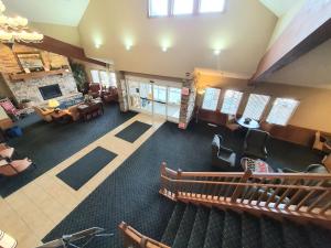 an overhead view of a living room with a fireplace at AmeriVu Inn and Suites - Waconia in Waconia