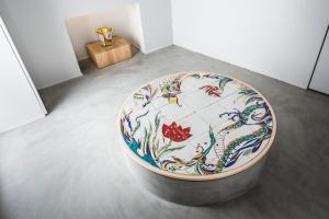 a large vase sitting on the floor in a room at BnA Alter Museum in Kyoto +86 photos