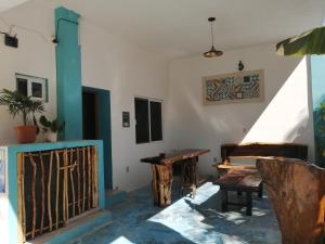 a room with a wooden table and a bench at Blue Coconut Cancun Hotel in Cancún