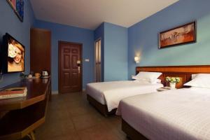 Krevet ili kreveti u jedinici u okviru objekta Sanya Tropical Coast Hotel