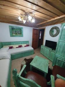 a bedroom with a bed and a table and a couch at Kashtata s Paraklisa in Borowo +57 photos