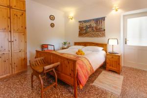 a bedroom with a bed with a teddy bear on it at b&b Antiche Pietre in Bollengo